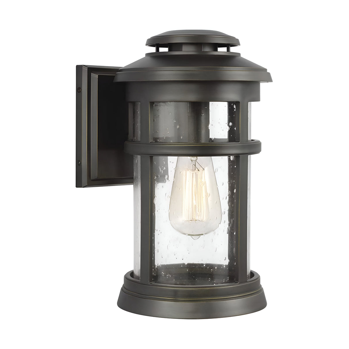 The Newport 1 Light Outdoor Medium Wall Lantern features a vintage-style design with an antique bronze finish and clear seeded glass housing, showcasing an exposed Edison bulb. Its cylindrical design is mounted on a rectangular backplate, making it perfect for adding coastal charm to your exterior spaces.