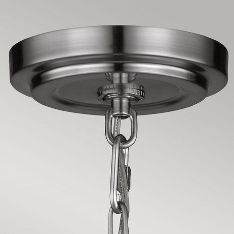 Close-up view of the Parkman 1 Light Large Pendant with a metal canopy in a polished nickel finish. A chain is attached for hanging, adding an elegant touch to various interior styles against a neutral background.