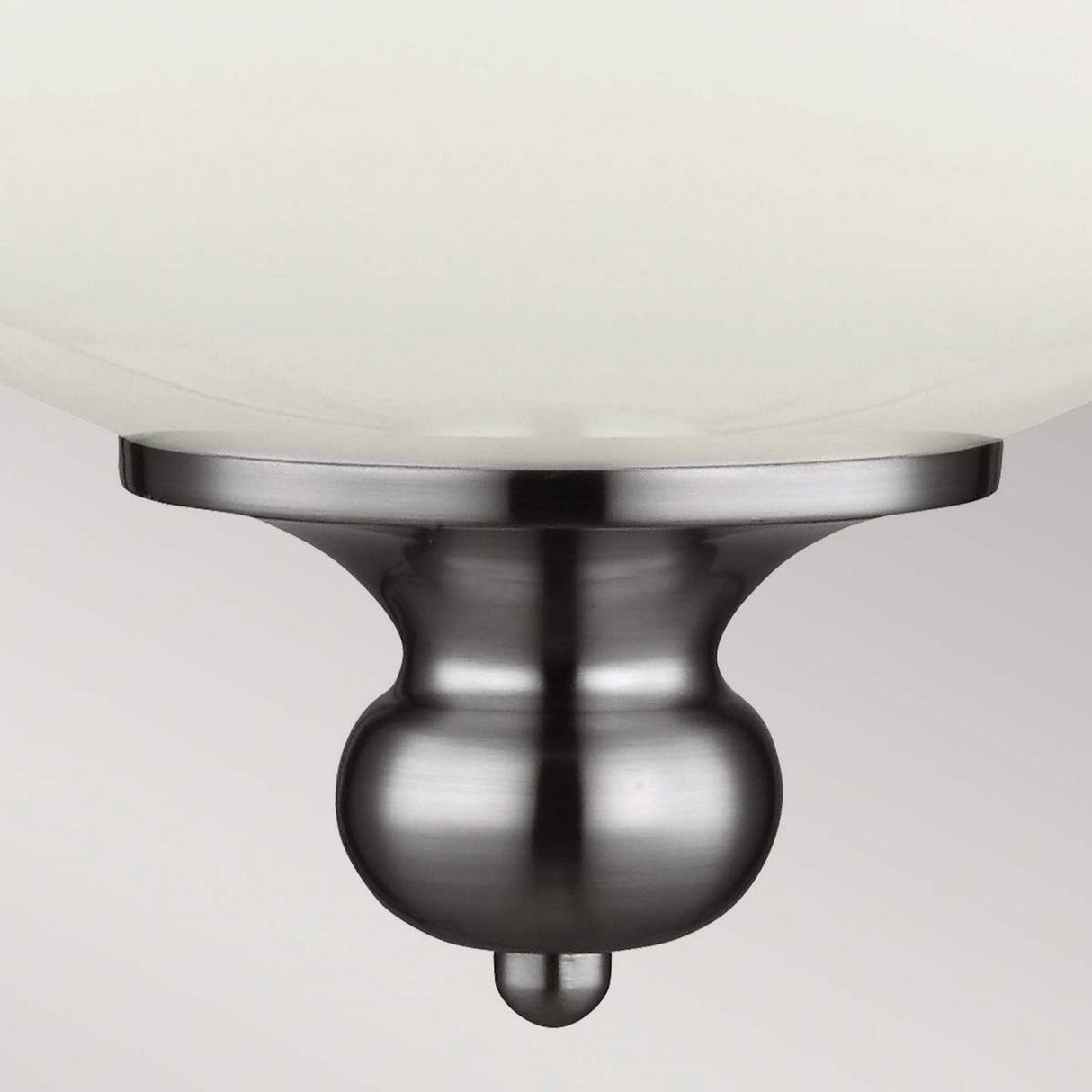 Close-up of the Parkman 1 Light Large Pendant in polished nickel, featuring a smooth, rounded design. The pendant embodies a sleek, minimalist style that effortlessly complements various interior settings against a neutral background.