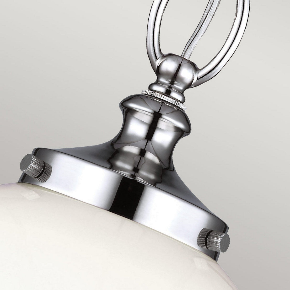Close-up of the Parkman 1 Light Small Pendant in polished nickel, featuring a modern aesthetic with an attached white glass dome. This fixture showcases stylish metallic elements and a smooth, elegant design against a plain background.