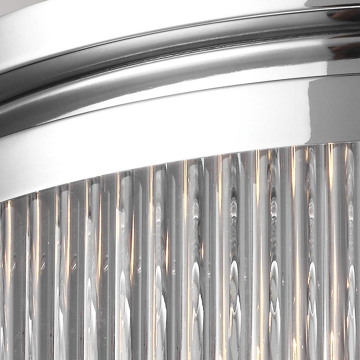 Close-up of the Paulson 3 Light Flush - Chrome, featuring a polished chrome frame. This sleek and modern fixture showcases vertical clear glass rods, adding sophistication and reflective appeal.