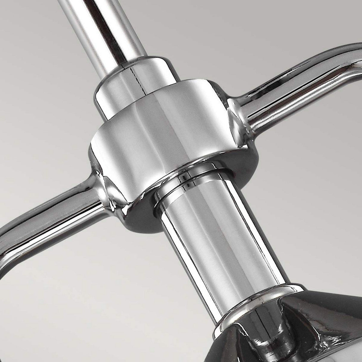 Close-up of the Paulson 1 Light Mini Pendant in a chrome finish, featuring adjustable handles and a sleek cylindrical design, set against a gray background.