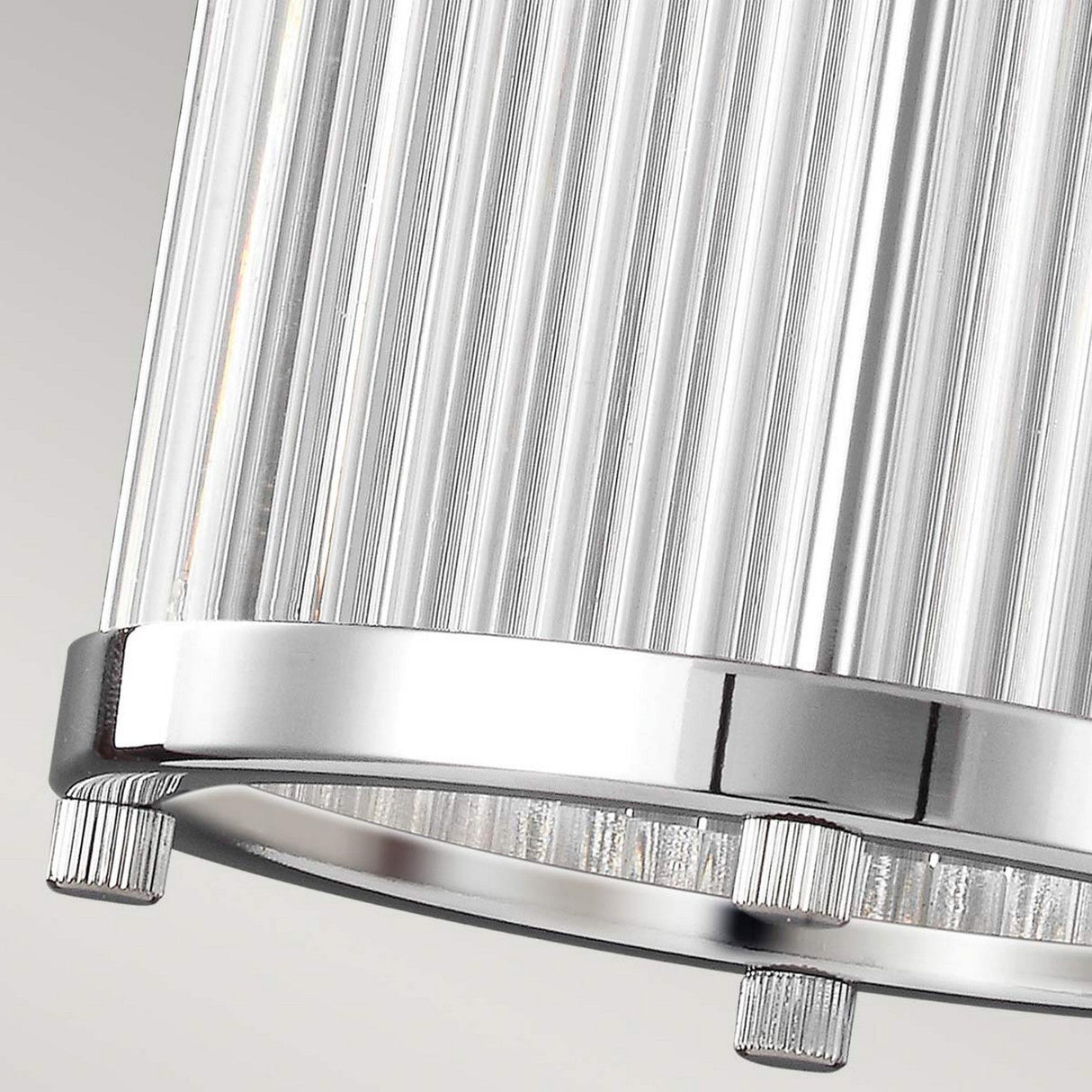 Close-up of the Paulson 1 Light Mini Pendant - Chrome, showcasing a ribbed glass tube shade with a reflective chrome base. The textured glass enhances the sleek metallic finish with its decorative element.