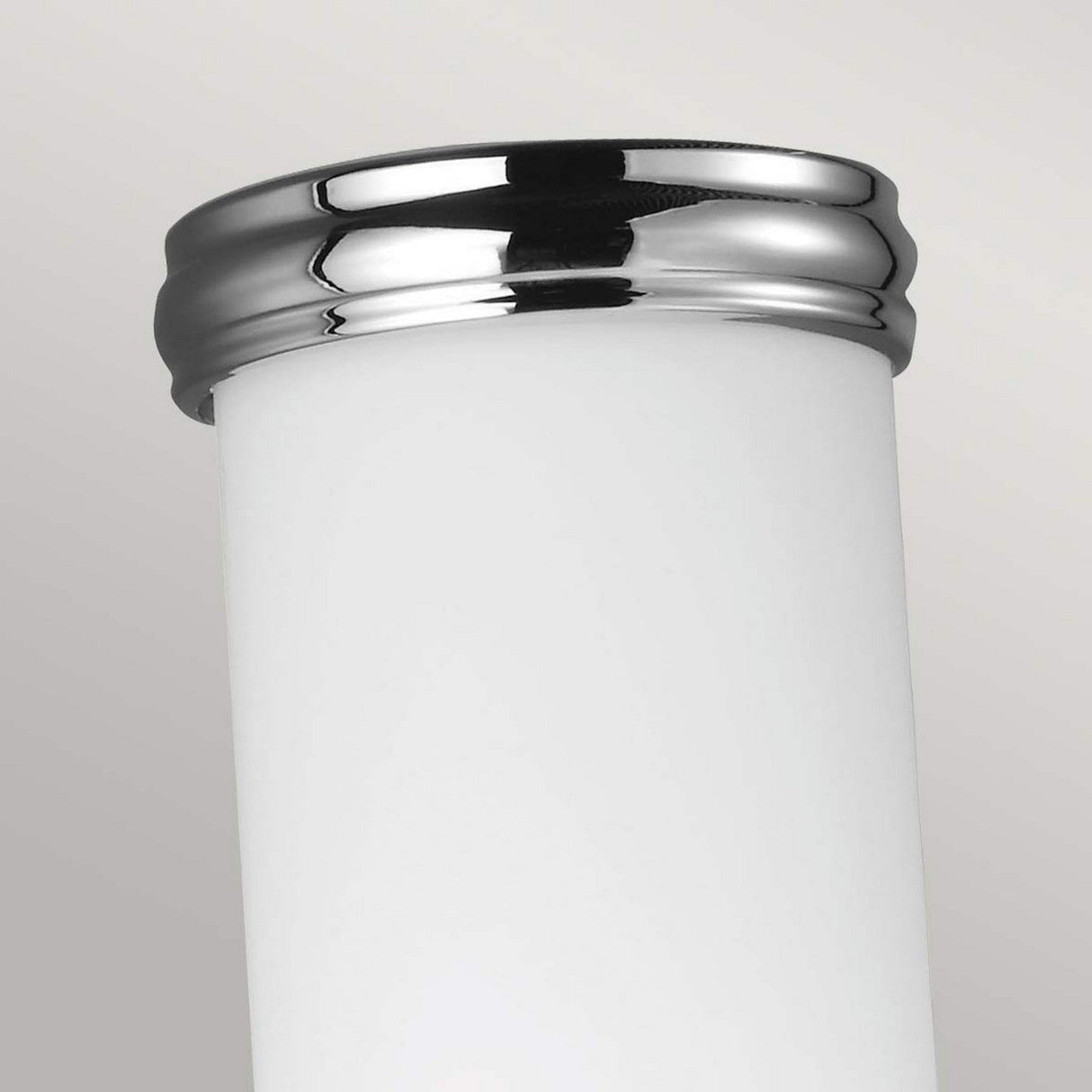 Close-up of the Payne-2 1 Light Wall Light, showcasing a polished chrome finish at the top and an opal etched glass body, set against a neutral gray background.