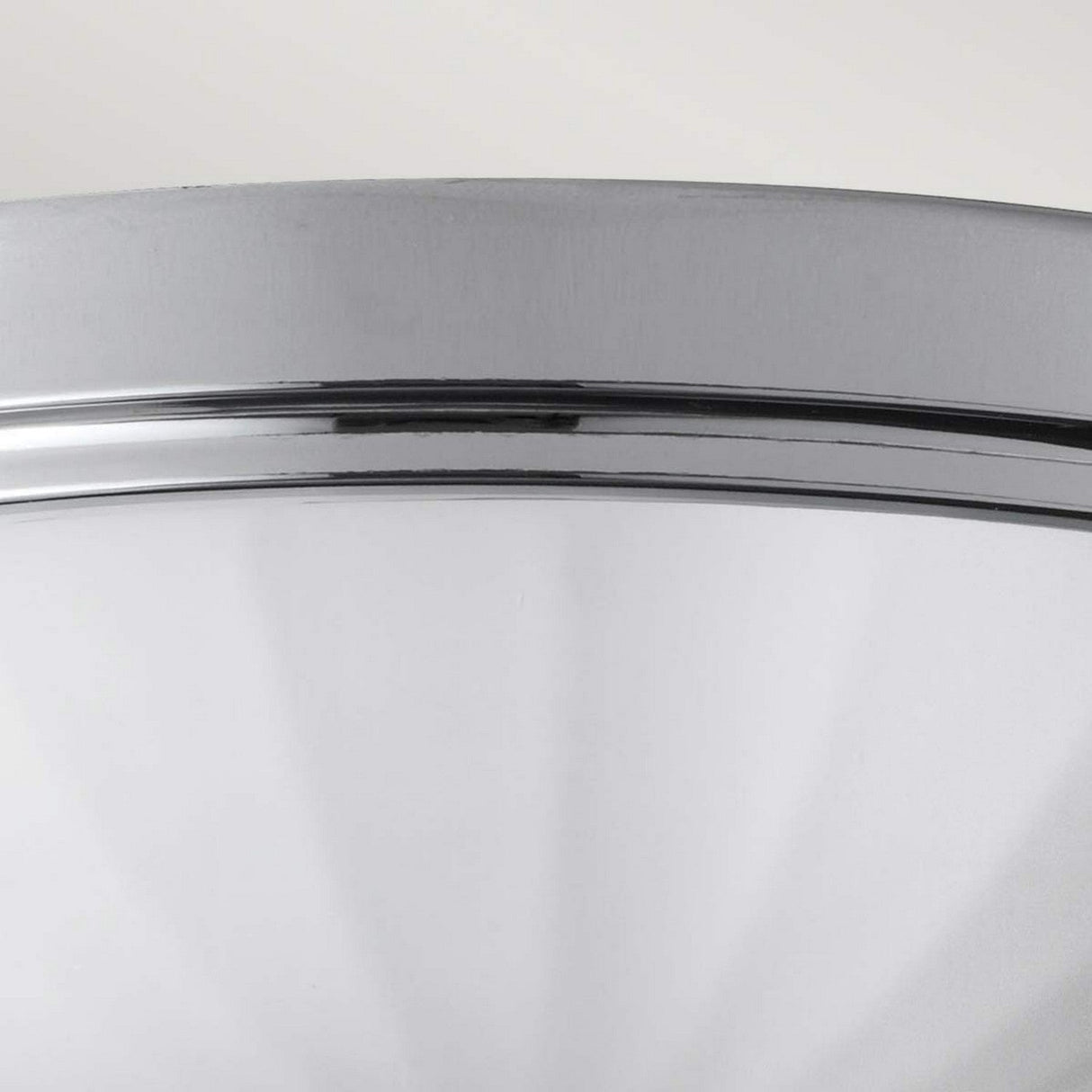 Close-up of the Perry 2 Light Flush in polished chrome, showcasing its frosted glass dome, ideal for a modern bathroom. The design is sleek and contemporary with a brushed metal rim in polished chrome. The image highlights the top section of the light fixture against a plain background.