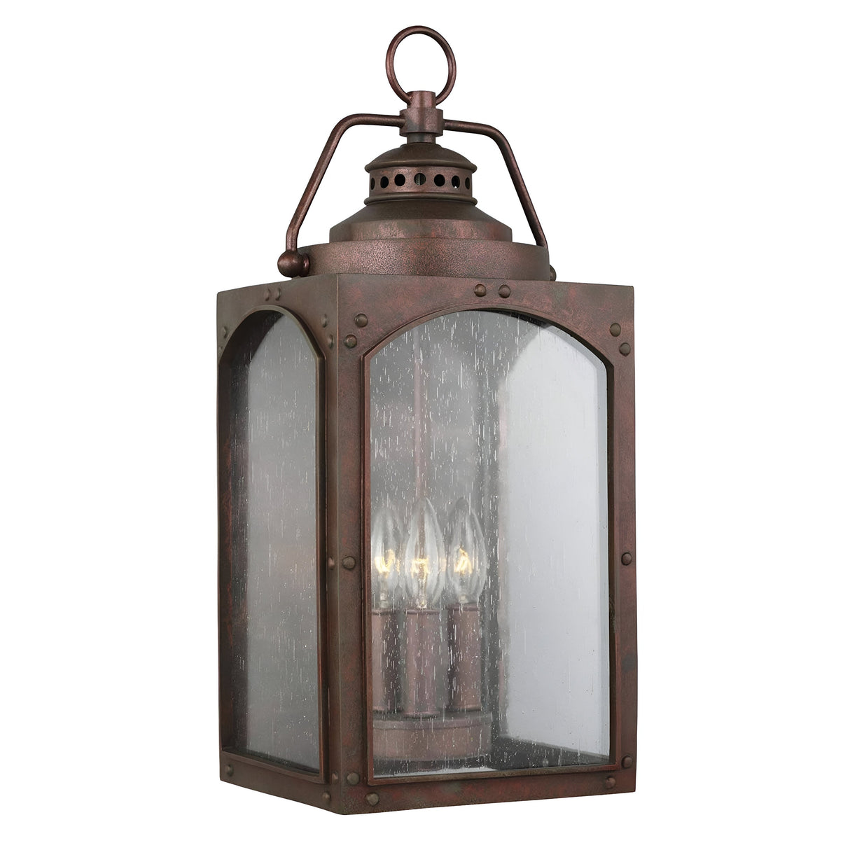 The Randhurst 3 Light Outdoor Large Wall Lantern features a vintage design with a copper oxide finish, clear glass panels, and space for three candle-shaped bulbs. Constructed from durable composite materials, it also includes a decorative handle loop on top.