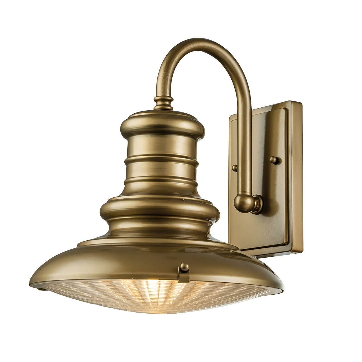 The Redding Station 1 Light Outdoor Medium Wall Lantern in bronze, with its vintage-style design, curved arm, and detailed features, showcases a round ribbed glass shade that emits a warm glow, adding timeless vintage appeal to any space.
