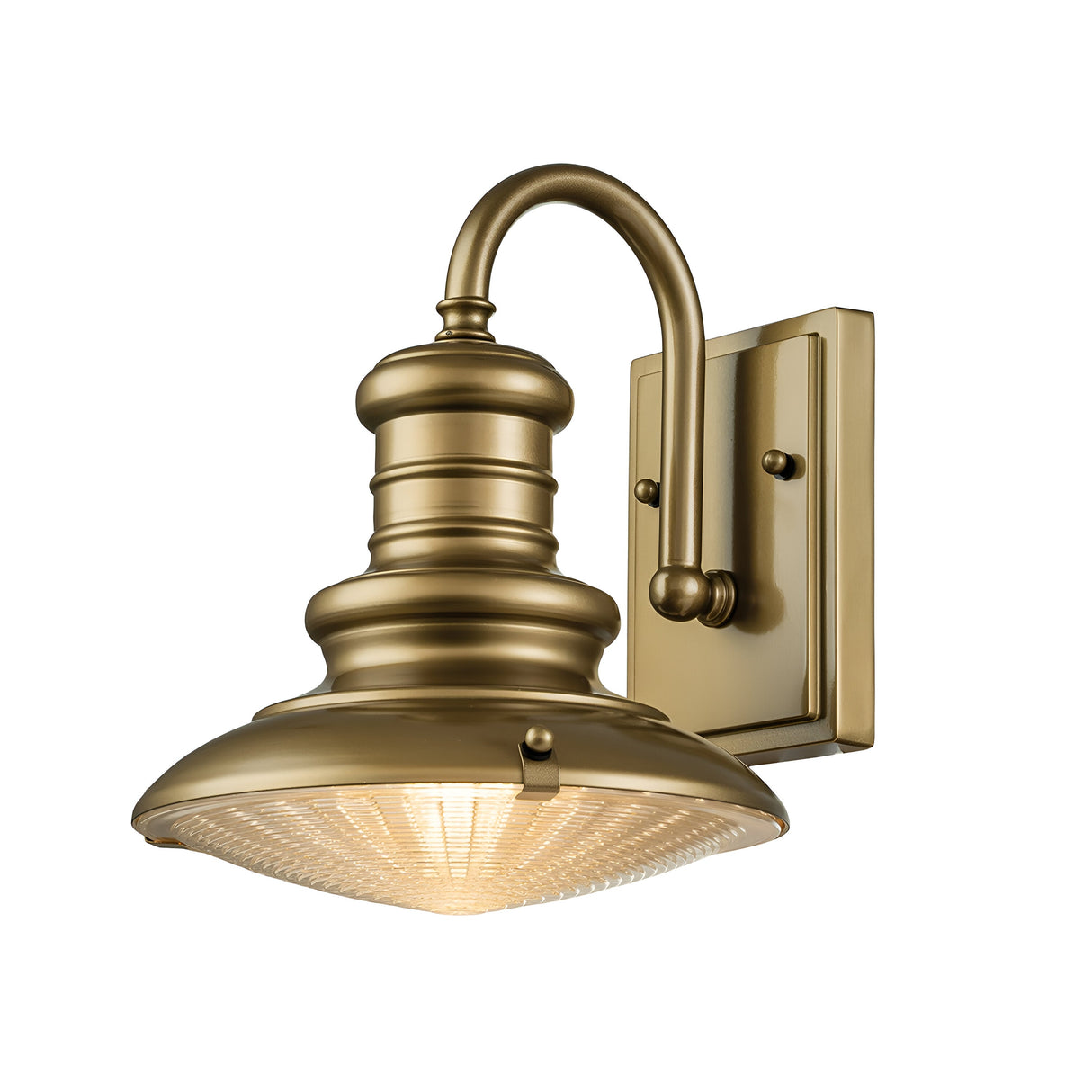 The Redding Station 1 Light Outdoor Small Wall Lantern showcases a vintage design with a curved arm and a prismatic glass shade, mounted on a rectangular backplate. Its warm bronze finish adds to its charm.