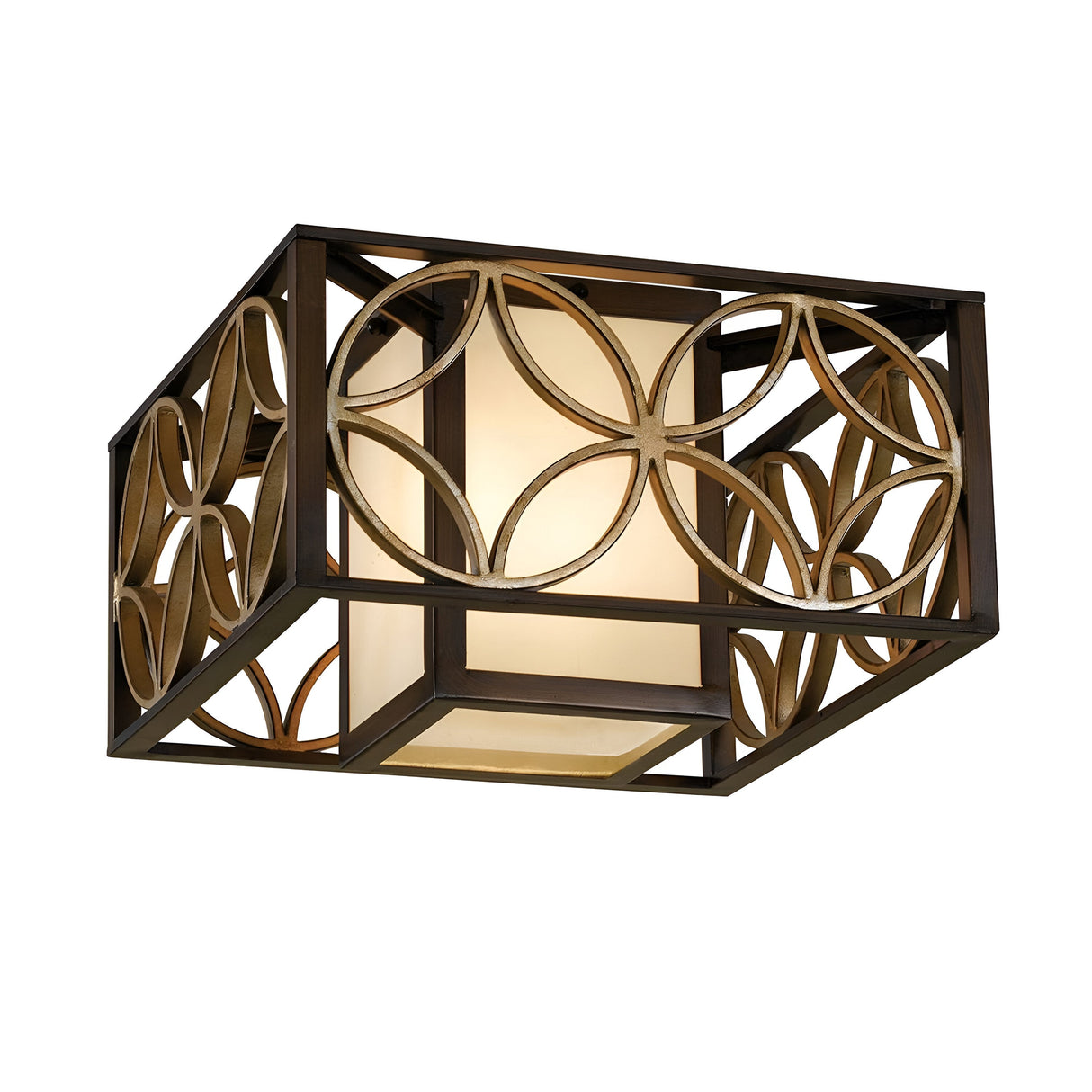 The Remy 2 Light Flush in Heritage Bronze and Parisienne Gold features a square ceiling light fixture with an intricate geometric design of overlapping circles, echoing the French Arts and Crafts style. Its frosted glass diffuses a warm glow, creating an inviting ambiance.