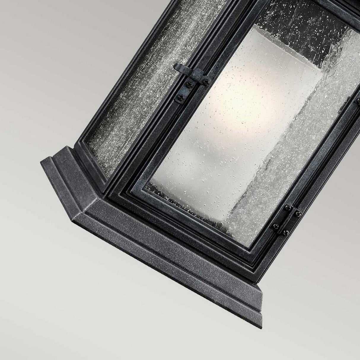 The Shepherd 1 Light Outdoor Large Wall Lantern in Dark Weathered Zinc offers a rectangular black design with vintage gas lantern charm. It features clear glass panels that are slightly frosted with droplets, enhancing its textured appearance against a neutral backdrop for both style and durability.