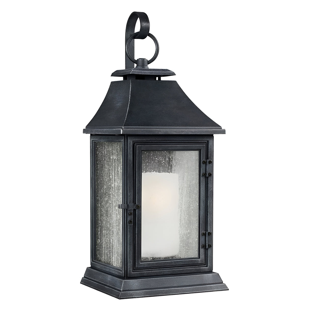 The Shepherd 1 Light Outdoor Extra Large Wall Lantern in Dark Weathered Zinc offers a classic design reminiscent of vintage street lighting. Featuring a glass enclosure and a handle on top, this lantern is constructed from weather-resistant composite material. It houses a white candle-shaped light, producing a cozy, warm glow.