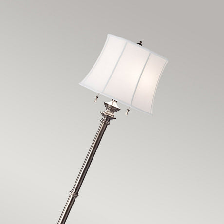 The Stateroom 2 Light Floor Lamp - Antique Nickel features a tall, slender stand in an antique nickel finish, topped with a square lampshade made of true white cotton linen. Set against a pale gray background, the lamp's elegant design is enhanced by the addition of two hanging pull chains below the shade.