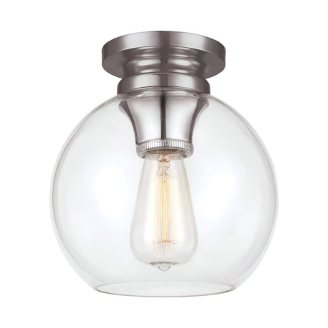 The Tabby 1 Light Flush - Polished Nickel is a ceiling-mounted fixture that showcases a round, clear glass globe with an exposed filament bulb. The base features a polished nickel finish with a brushed texture. This piece combines contemporary lighting design with simplicity, offering a warm and inviting glow.