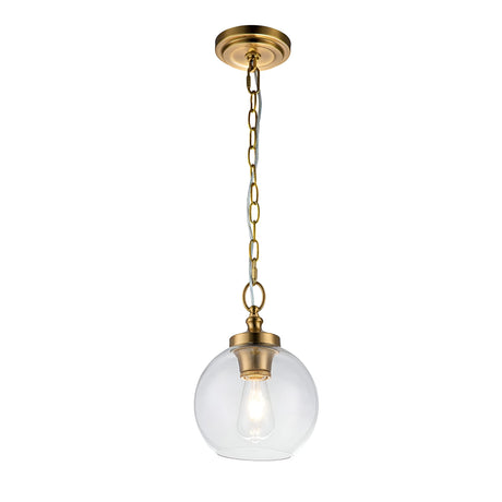 The Tabby 1 Light Mini Pendant in Burnished Brass boasts a sleek design with a burnished brass chain and fixture, complemented by a clear glass globe that showcases an exposed bulb. This elegant piece highlights minimalist style and provides a modern aesthetic.