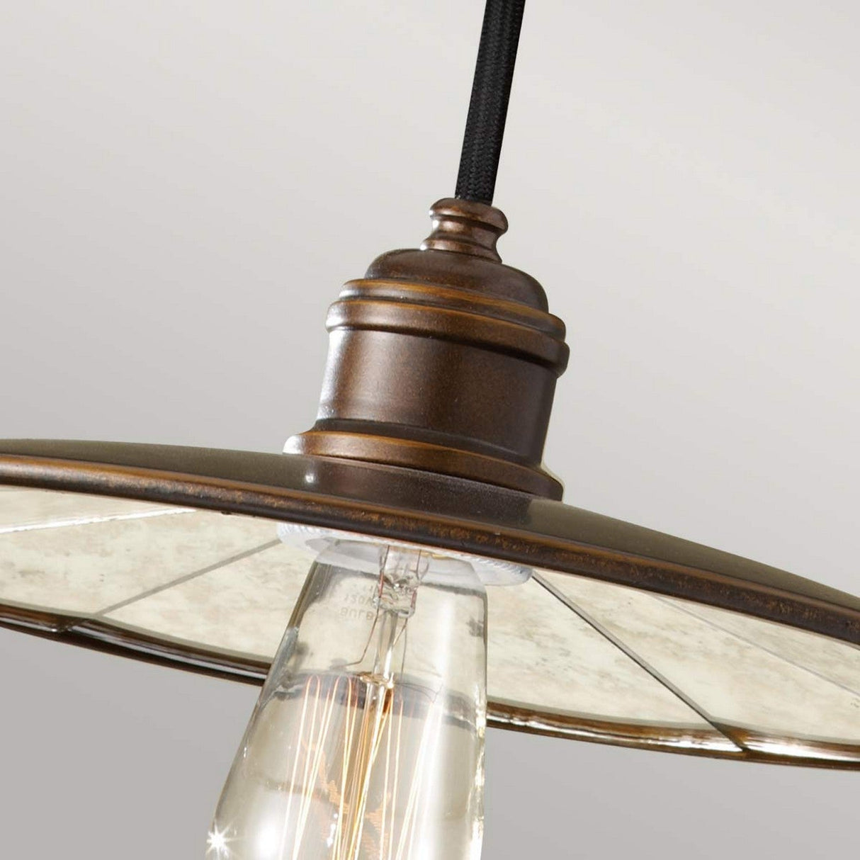 Close-up of the Urban Renewal 1 Light Pendant in a bronze finish. It showcases a clear glass shade and an Edison-style bulb, delivering an industrial aesthetic against a neutral background.