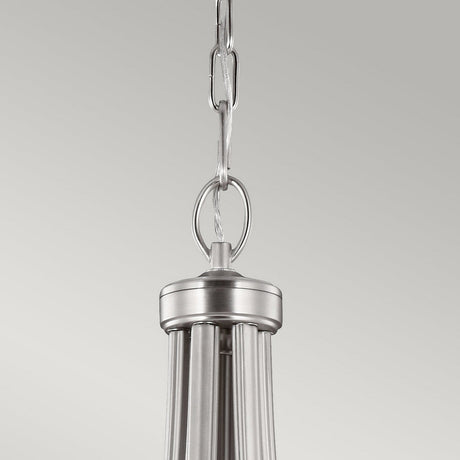 A close-up of the Vintner 9 Light Chandelier in satin nickel showcases its contemporary design, suspended by a linked chain against a plain gray background. The opal etched glass contributes to its sleek, modern aesthetic, reflecting the refined elegance typically associated with chandeliers.