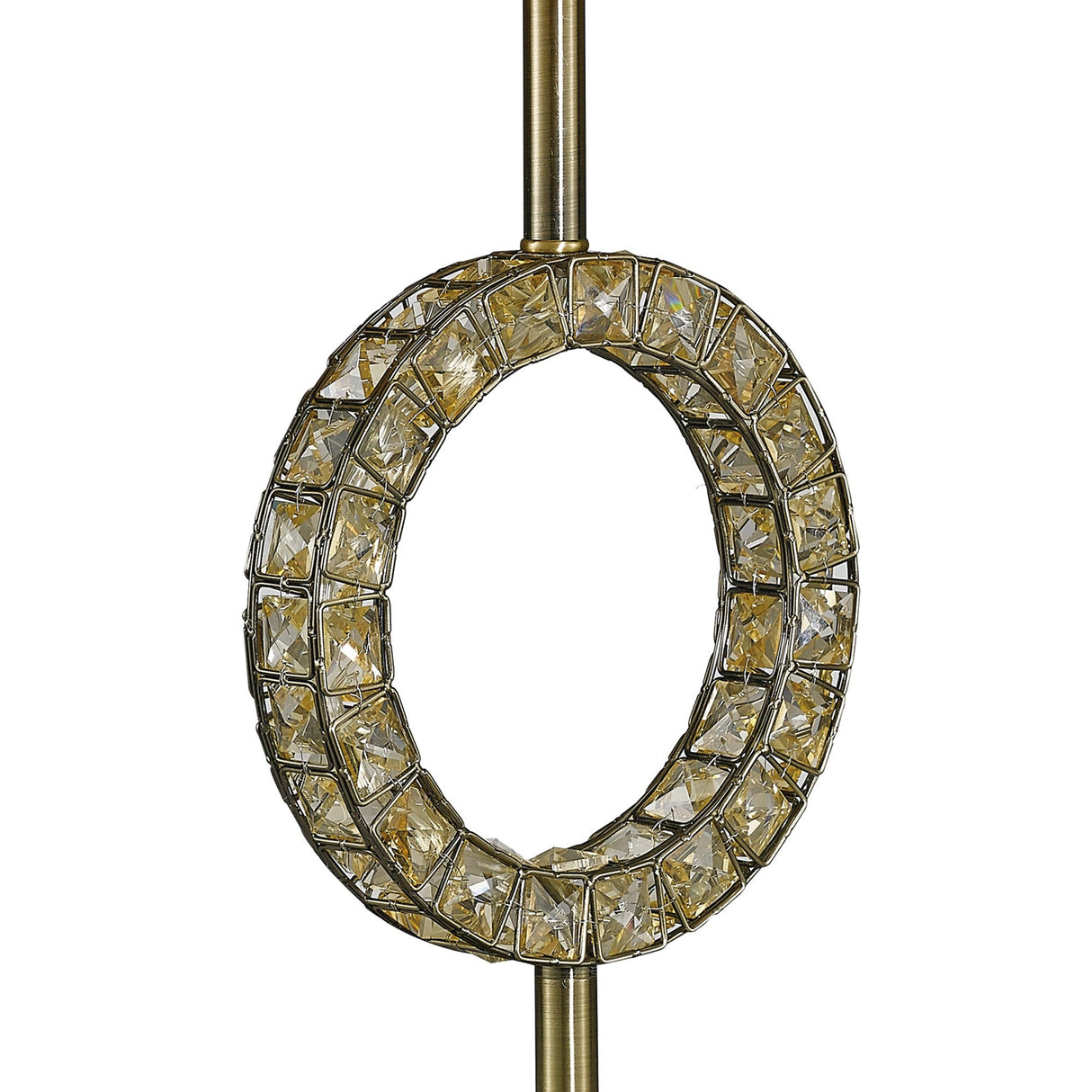 The Florence Round 1 Light Crystal Table Lamp features faceted crystal accents set in a brass ring, attached to a vertical brass rod for an elegant, vintage-inspired look. Comes with a cream shade.