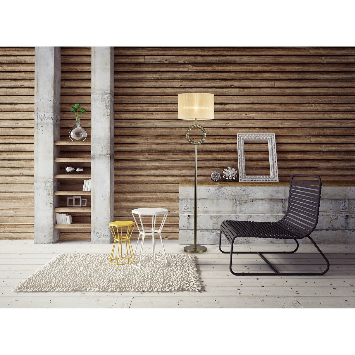 A modern living space with wooden panel walls, a Florence Round 1 Light Crystal Floor Lamp in brass with a cream shade, a black wire chair, two small round tables, a beige rug, wall shelves with decor, and empty picture frames on the floor.