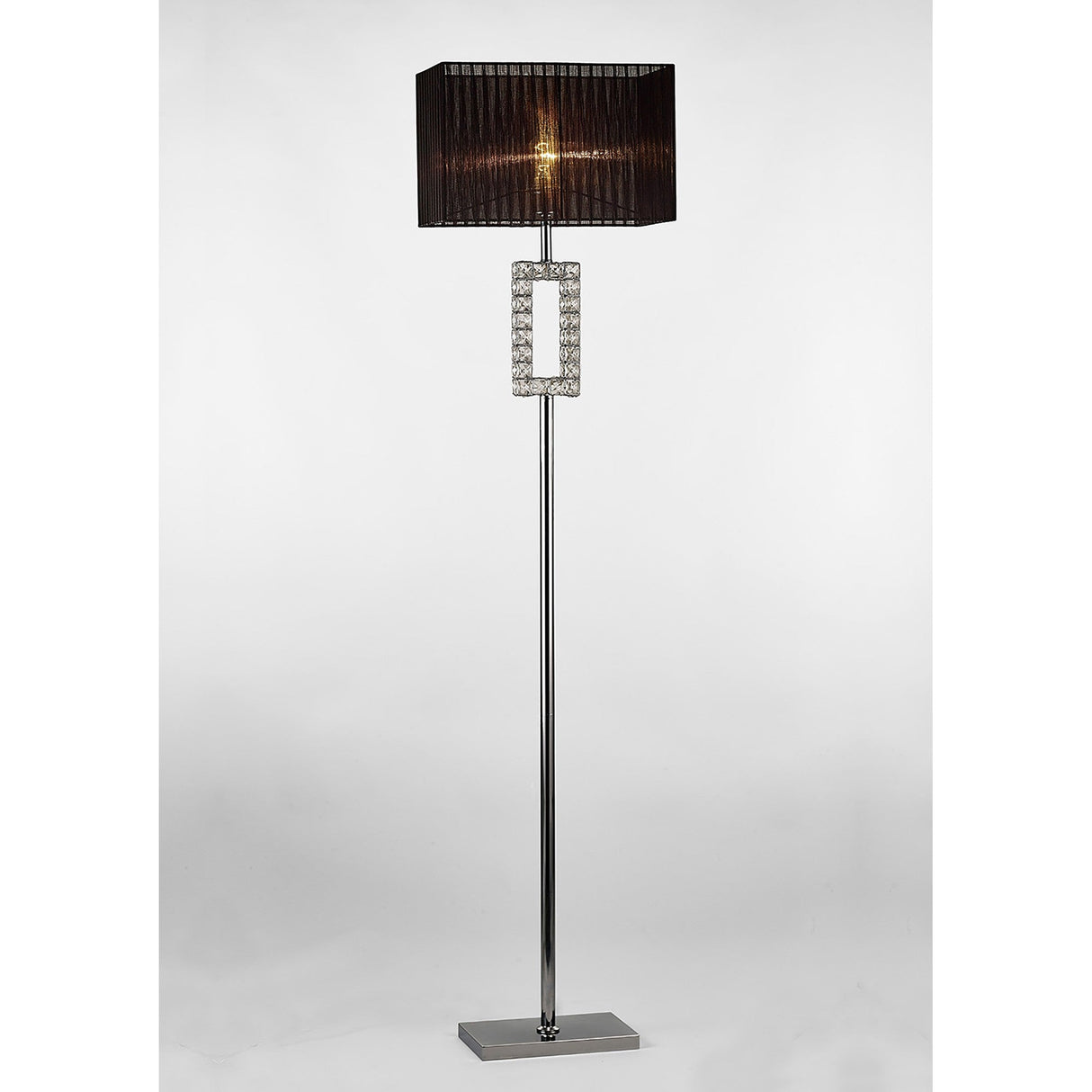 The Florence Rectangle 1 Light Crystal Floor Lamp features a chrome stand, decorative crystal accents, and a white rectangular shade for a touch of modern elegance in any room.