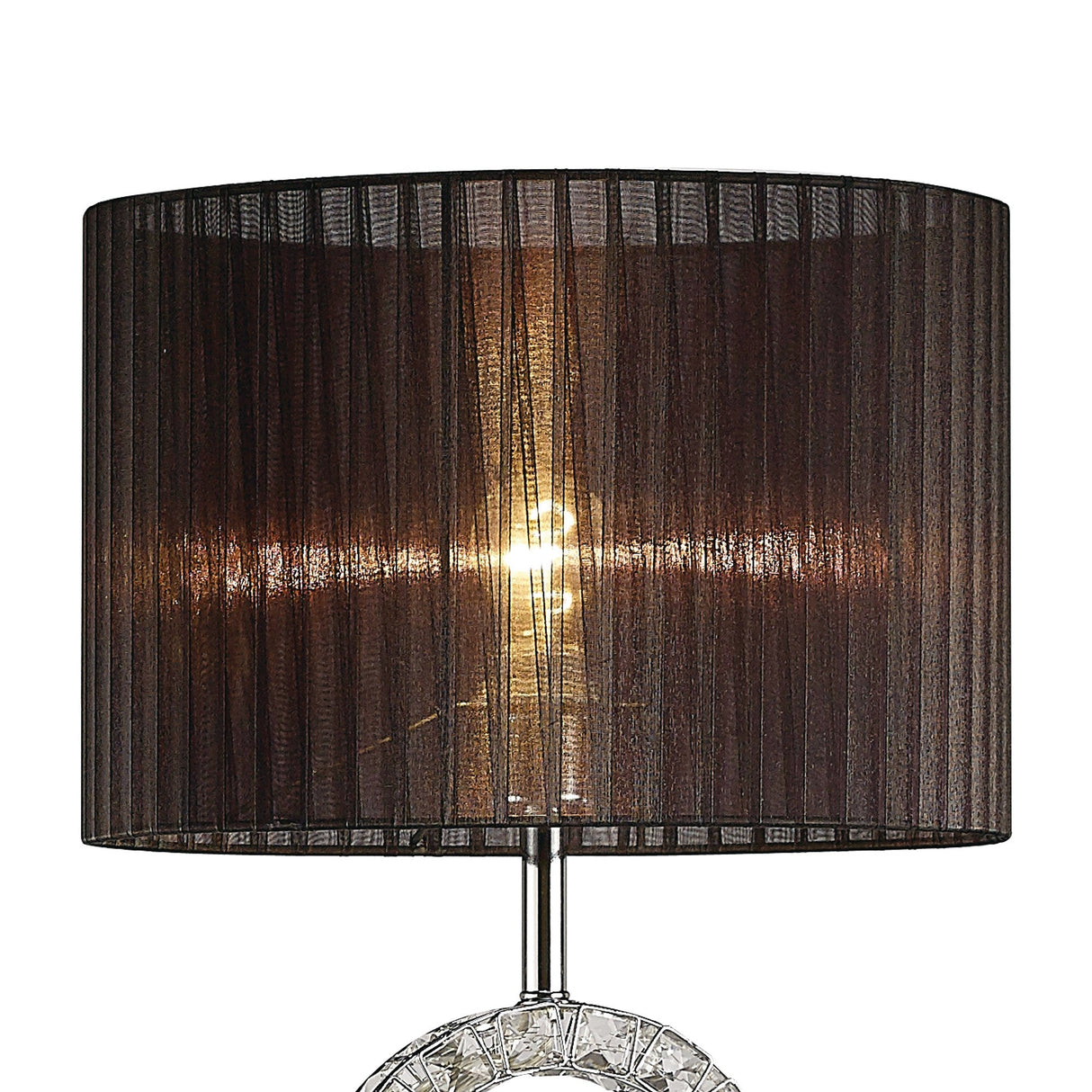 The Florence Round 1 Light Crystal Floor Lamp in chrome features a crystal base and a cylindrical semi-transparent black shade. When illuminated, it casts ambient light with a warm glow through the shade’s vertical textured lines.