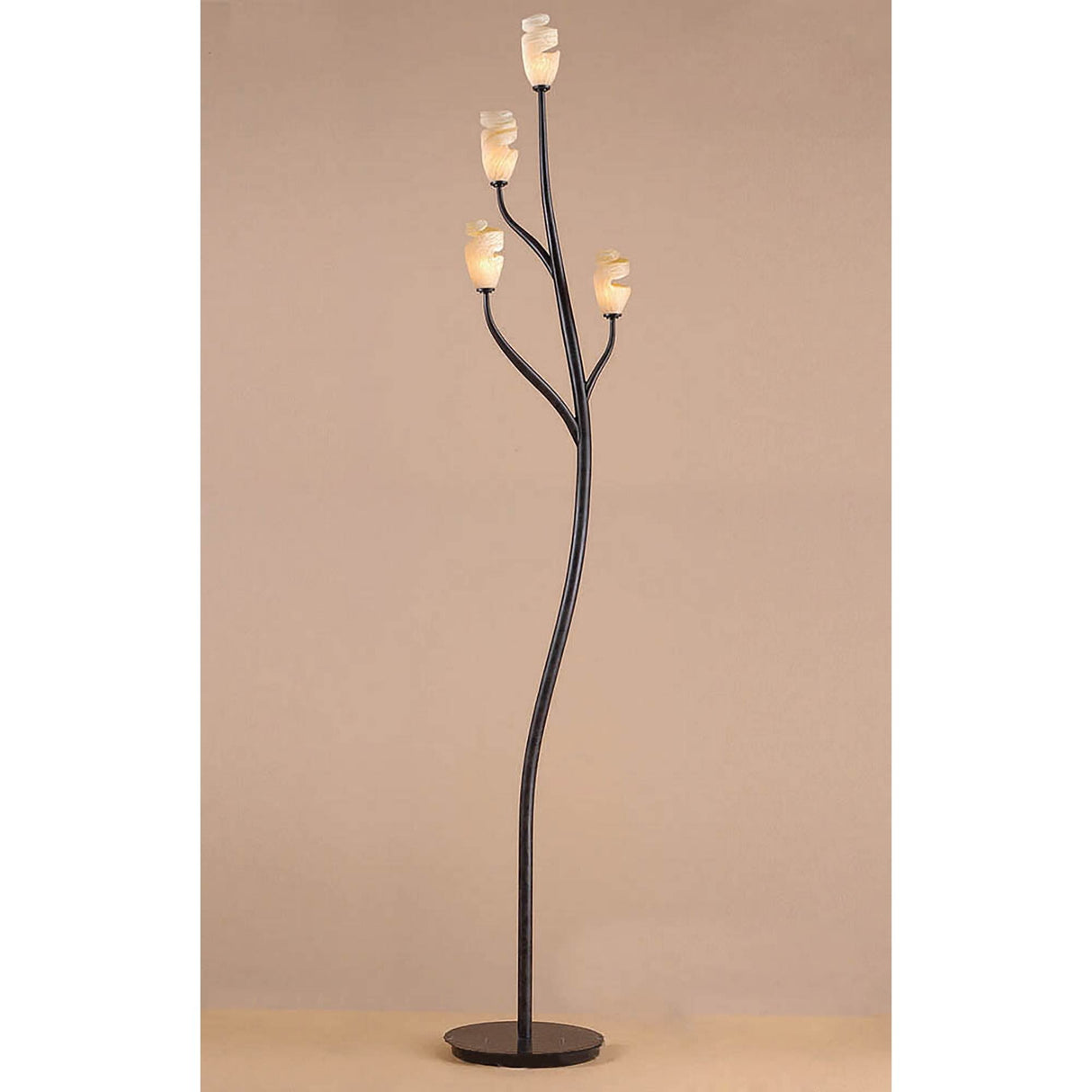 The Forest 4 Light Floor Lamp in Brown & Black Oxide features a dark metal base branching into four curved arms, each with an amber frosted glass flower bud shade, shown against a plain beige background.