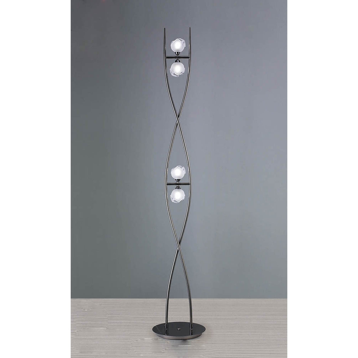 The Fragma 4 Light Floor Lamp - Black features a twisted metal frame with four evenly spaced spherical white bulbs and stands on a round black base.
