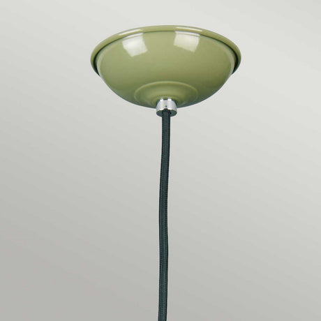 The Franklin Pendant Light - Green, featuring a glossy finish and black cord, exudes retro-inspired charm. This ceiling fixture is perfect for task lighting and elegantly contrasts against a plain, light gray background.