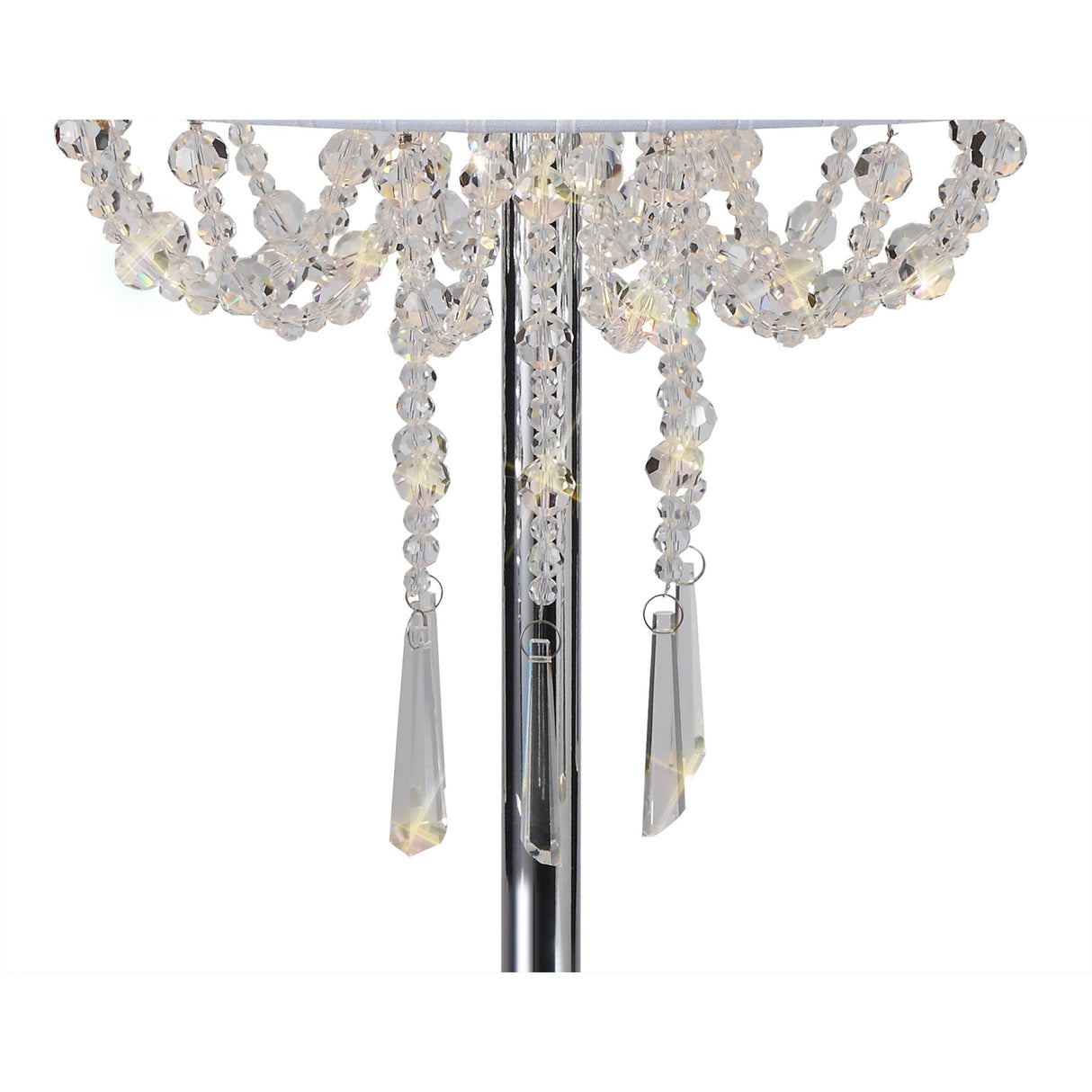 Close-up of the Freida 3 Light Crystal Table Lamp, featuring hanging faceted crystal beads and teardrop pendants elegantly draped on a polished chrome frame with a white shade.