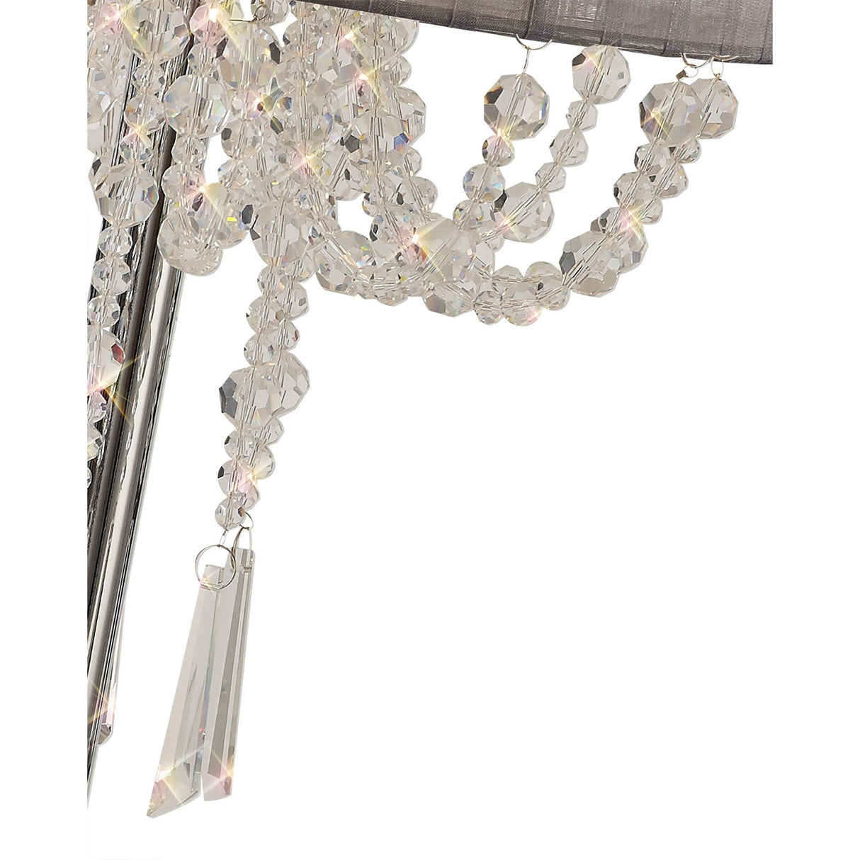 Close-up of clear, faceted crystal beads and a prism pendant on the Freida 3 Light Crystal Table Lamp—chrome finish with a grey shade—reflecting light in elegant, decorative strands.