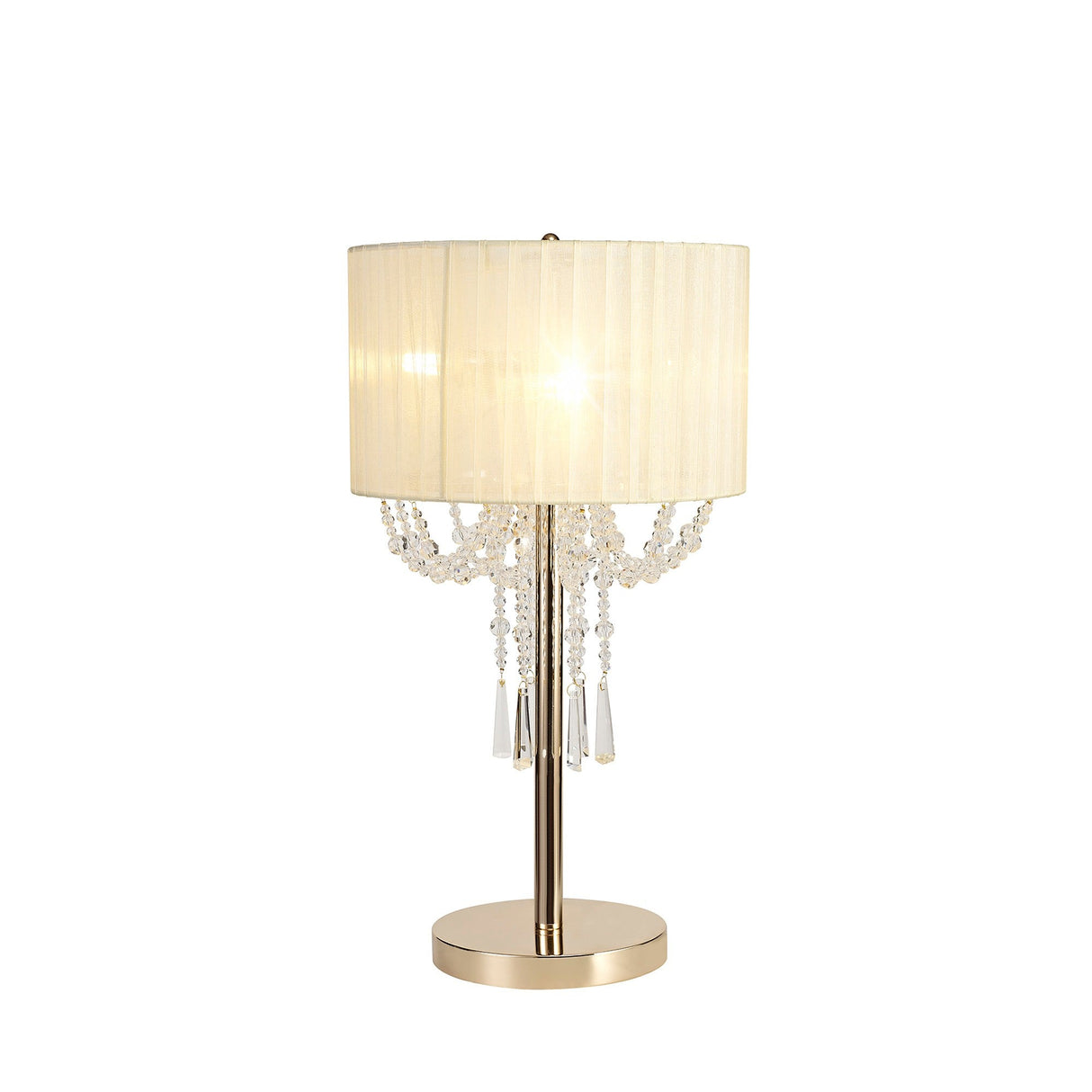 The Freida 3 Light Crystal Table Lamp features a gold round base, cream organza shade, and draped crystal accents around the edge, casting a warm, soft glow.