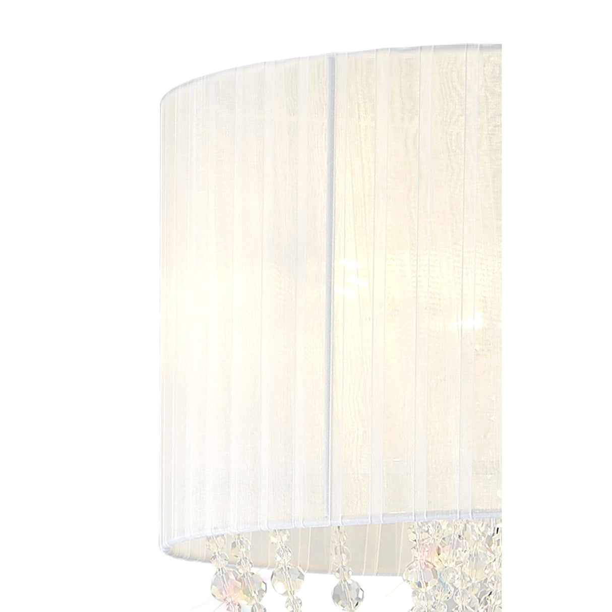 A close-up of the Freida 3 Light Crystal Floor Lamp in chrome, featuring a white fabric shade adorned with delicate crystal ornaments hanging from the edge, softly illuminated from within.