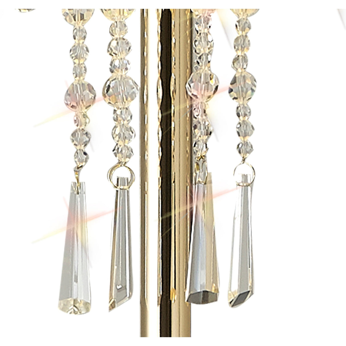 Close-up of clear faceted crystals and prisms on the Freida 3 Light Crystal Floor Lamp - Gold With Cream Shade, with sparkling light reflections and elegant geometric shapes enhancing the lamp’s luxurious look.