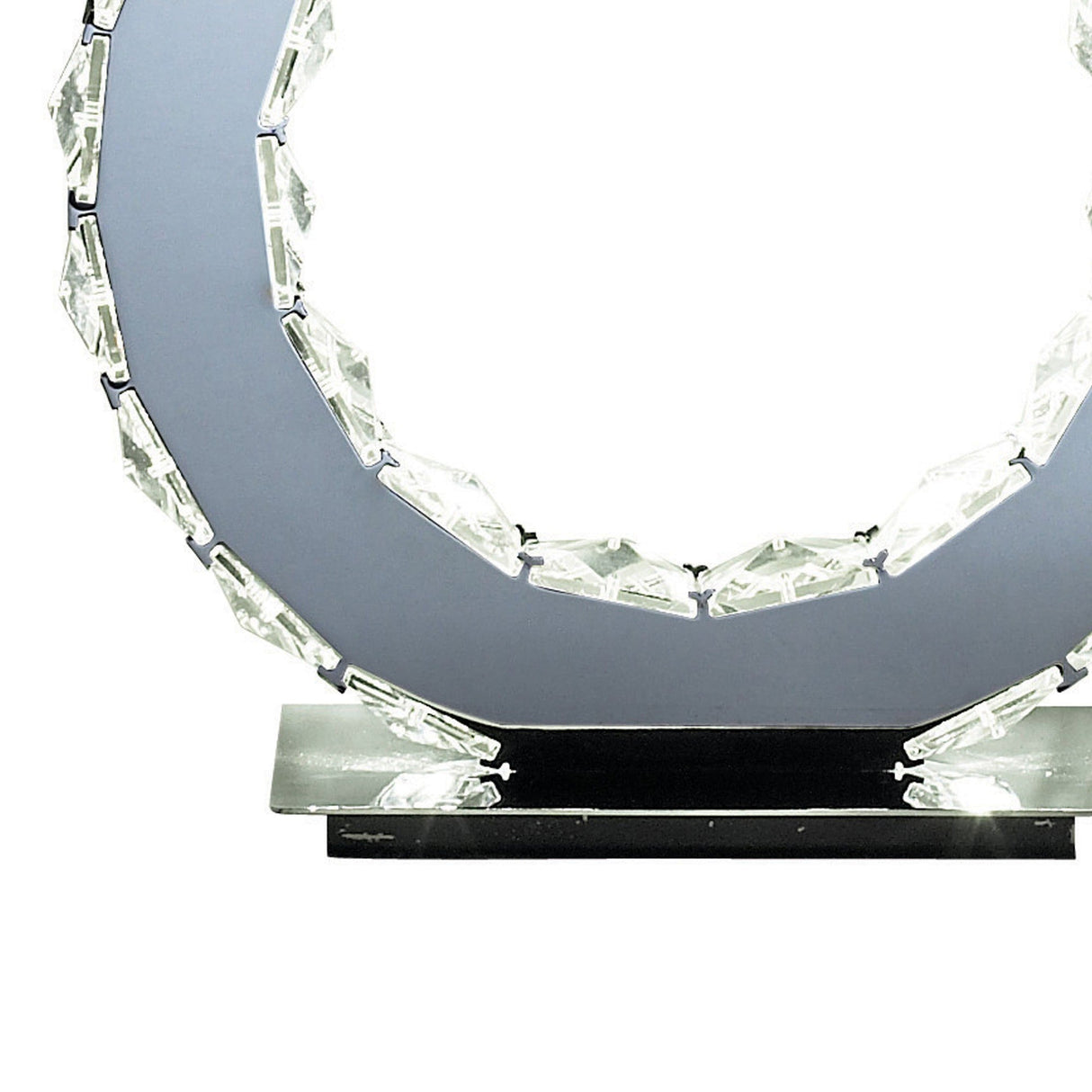 A close-up of the Galaxy LED Crystal Table Lamp 10W 6000K in Polished Chrome, showcasing its faceted crystal ring on a glossy rectangular base—ideal for adding stylish modern lighting to any space.