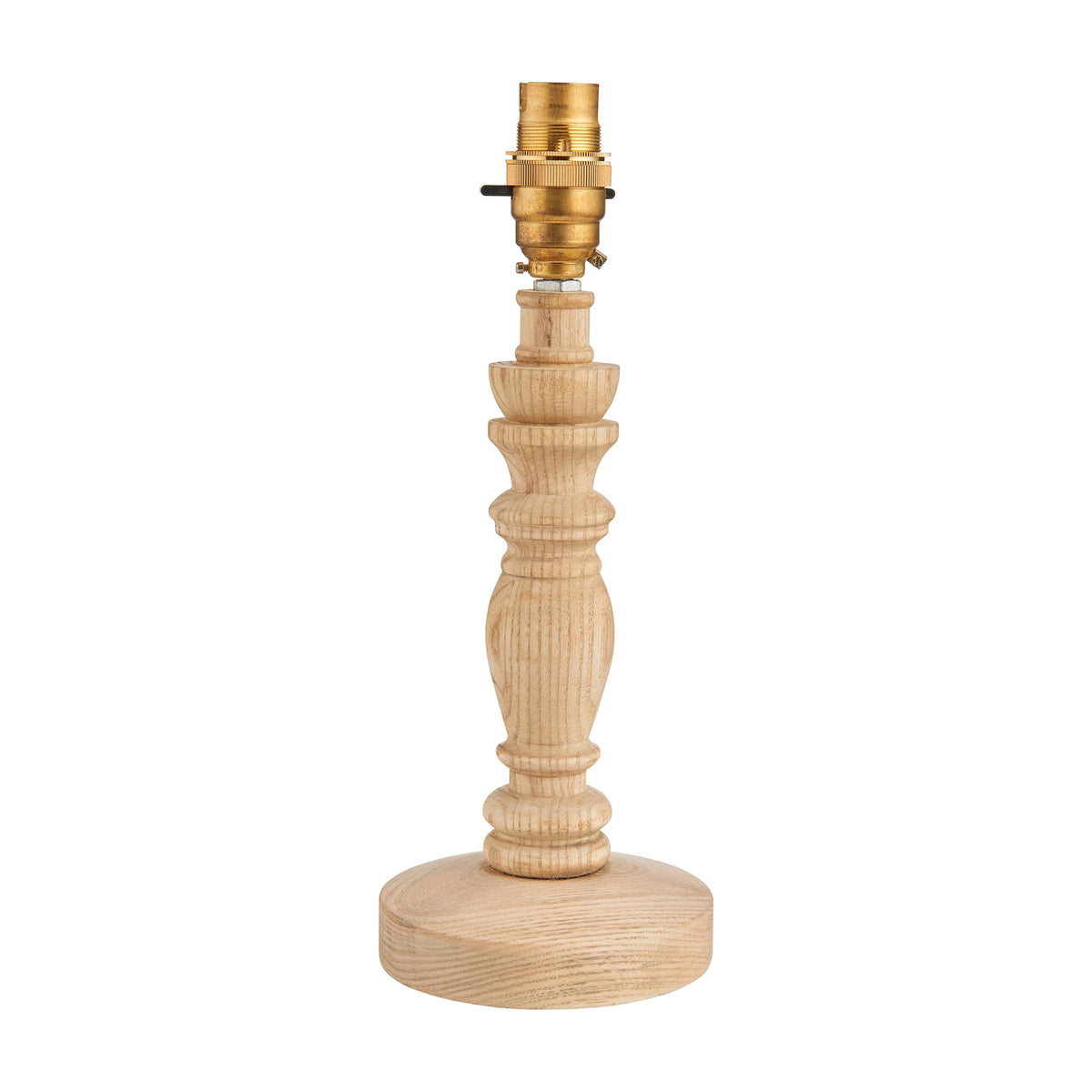 Gallery Direct Bevanne turned ash wood table lamp base in natural finish with candlestick profile, round foot and brass holder on a white background.