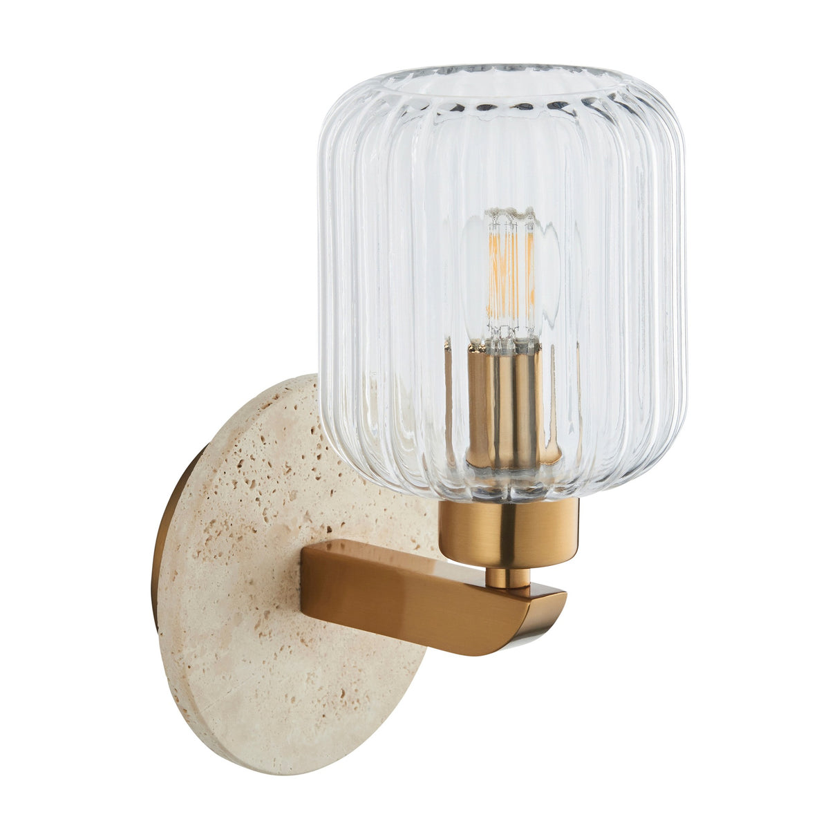 Gallery Direct Torvael Ribbed Wall Light with round travertine backplate, brass arm and ribbed clear glass shade holding a filament bulb.