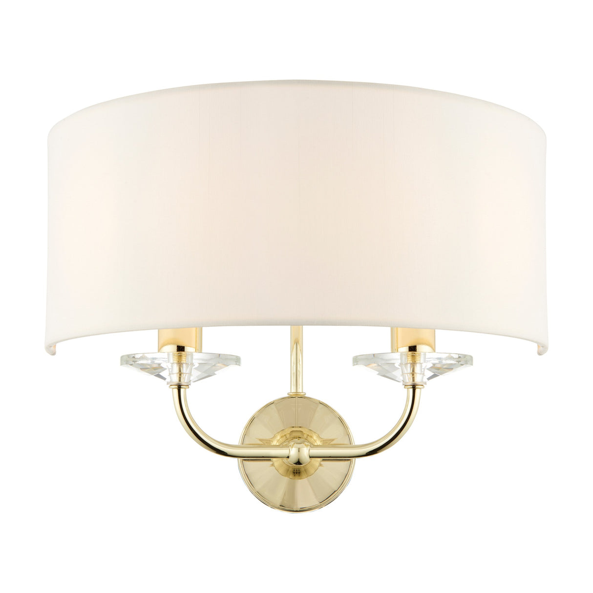 Gallery Direct Ostwyn 2 light wall fitting with vintage white half-drum fabric shade, brass curved arms and clear crystal accents on a round backplate.