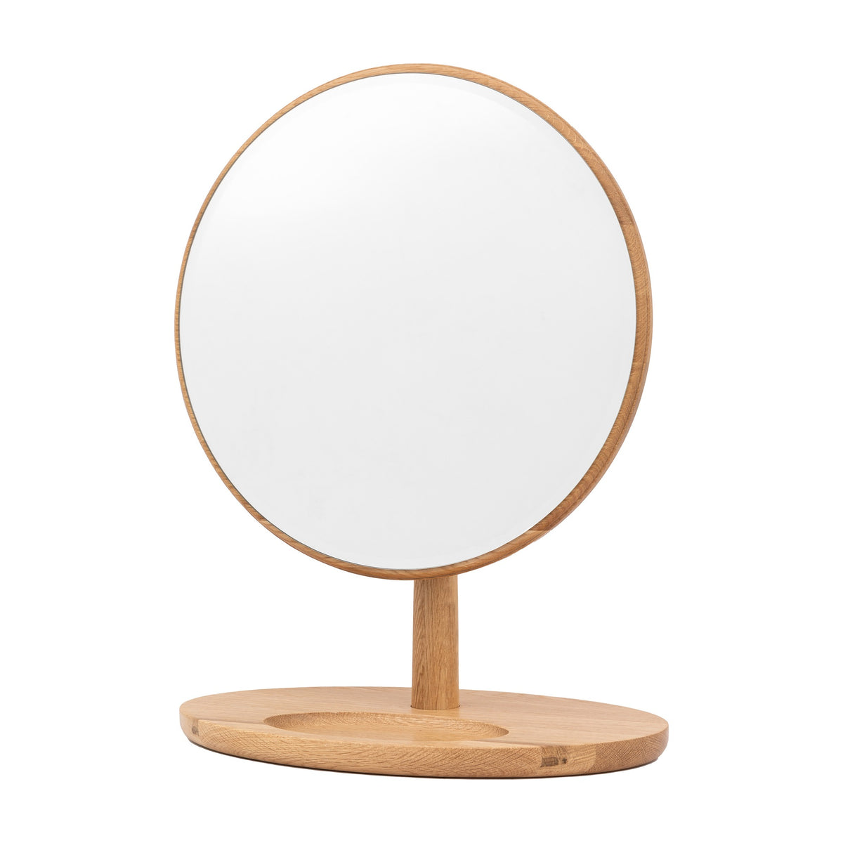 Gallery Direct Sabelle round dressing table mirror in oak, with slim wooden frame, upright stem, and oval tray base, on a white background.