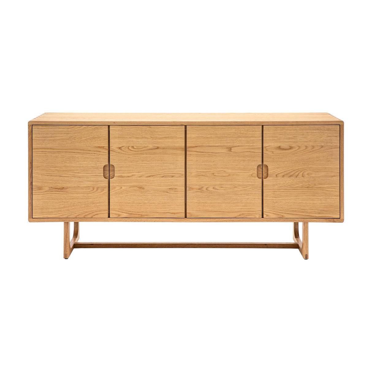 Gallery Direct Craft 4 Door Sideboard in natural oak with recessed pull handles and sled-style base with stretcher, shown on a plain white background.