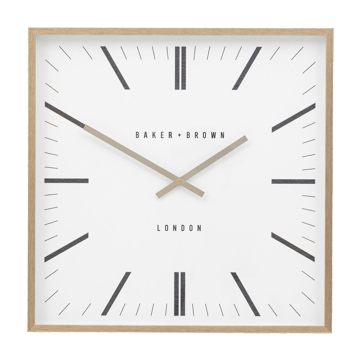 Gallery Direct Penvorne Square Wall Clock with pale oak frame, white dial, black graphic hour markers, slim gold hands, and BAKER + BROWN LONDON lettering.
