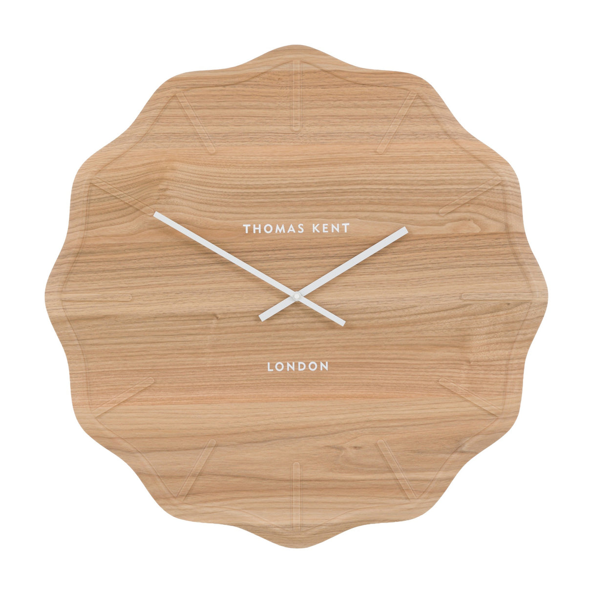 Harvane Wall Clock by Thomas Kent with scalloped light cedar wood-effect face, embossed markers and slim white hands on a white background.