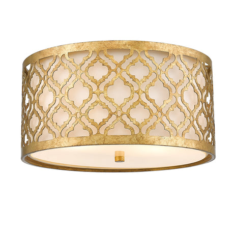 The Arabella 2 Light Flush - Gold With Ivory Shade features a distressed gold metal frame crafted into an elegant drum shape adorned with an intricate lattice pattern. The cylindrical design's geometric cutouts allow for a soft, energy-efficient glow from within, giving the fixture a warm and sophisticated look.