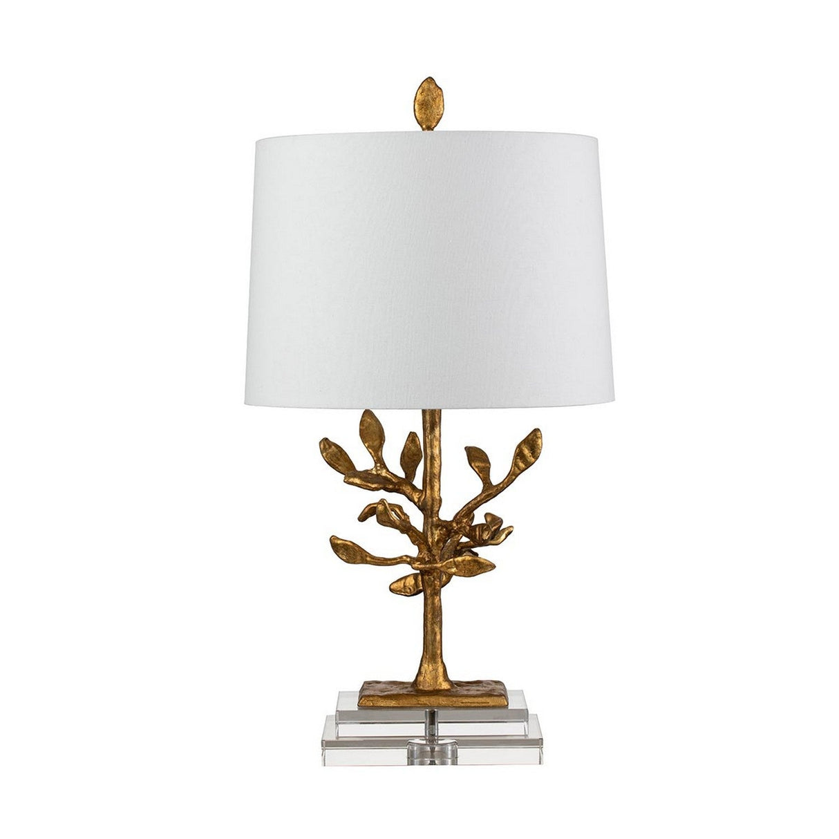 The Audubon Park 1 Light Table Lamp in Gold features an elegant design with a tree-like base crafted from gold cast metal, complemented by a white cylindrical fabric shade and a delicate leaf finial on top. It is beautifully set on a clear, layered K9 glass base.
