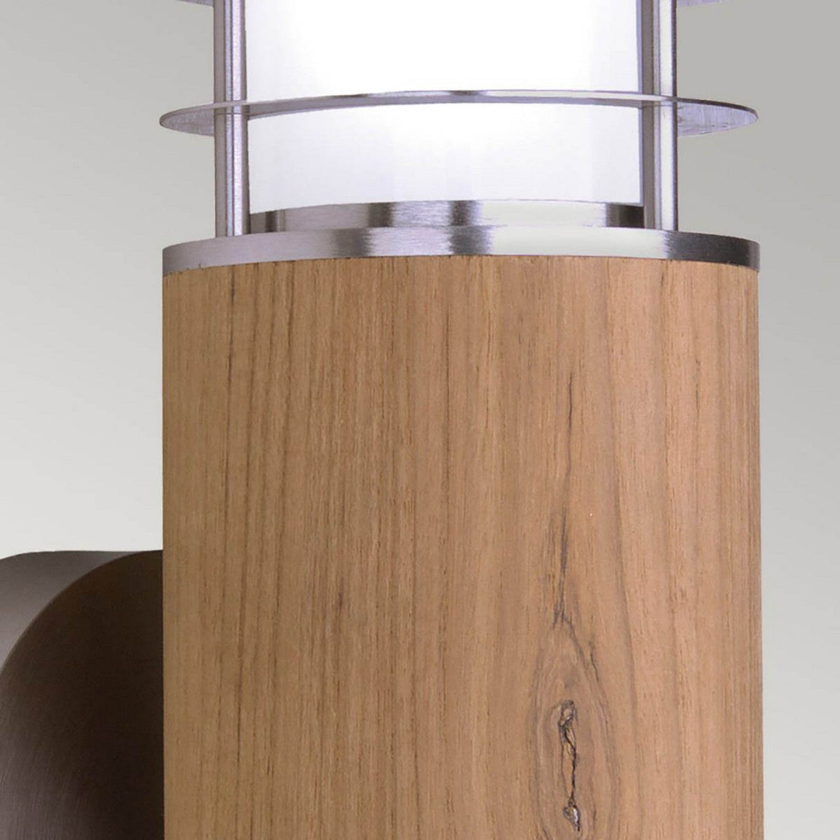 Close-up of the Poole 1 Light Outdoor Wall Light in light brown, showcasing a modern design with a wooden base and cylindrical frosted glass shade. With an IP44 rating and marine grade stainless steel accents, this fixture effortlessly merges contemporary style with natural elements for enhanced durability across various environments.