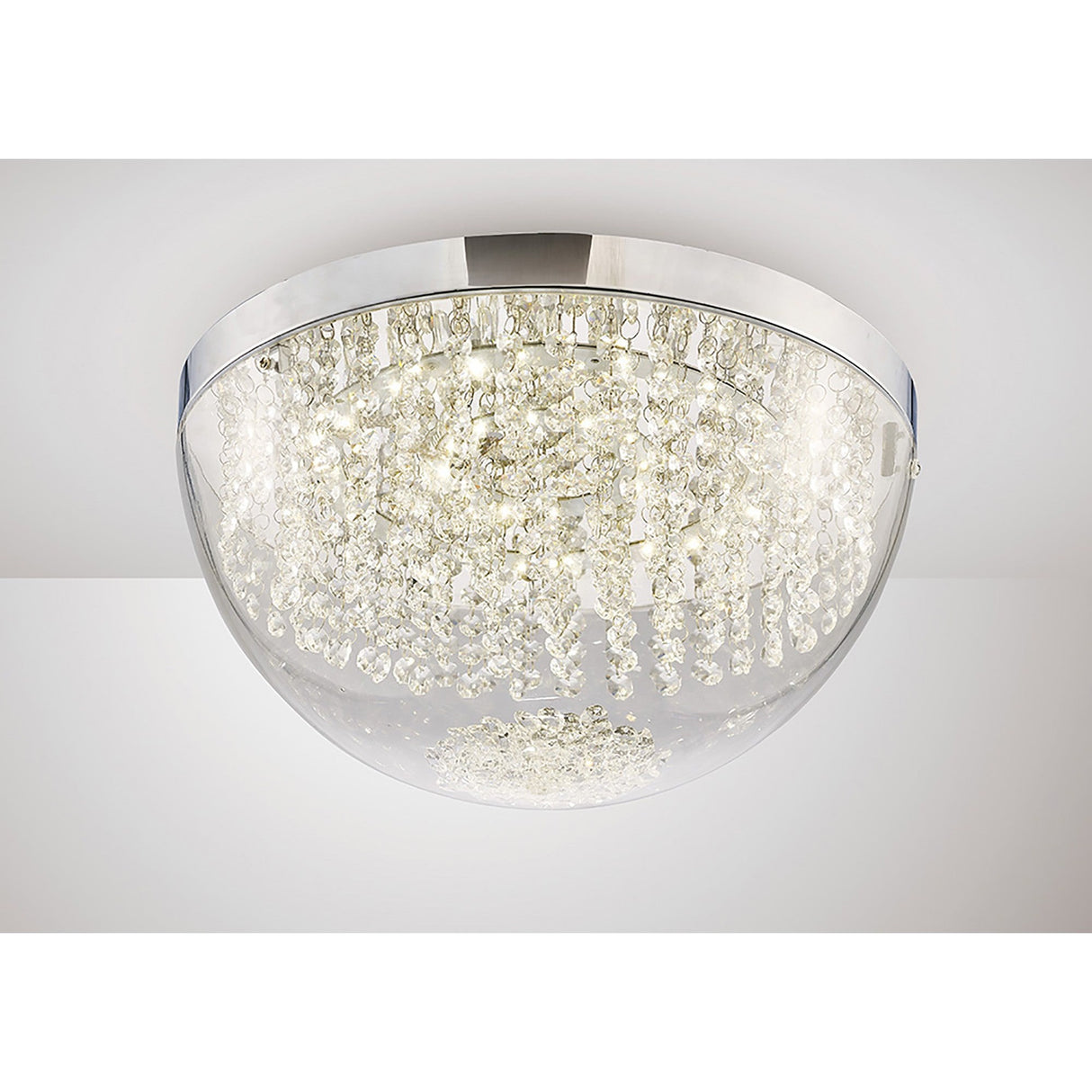 Diyas Harper Large LED flush ceiling light with a clear glass dome, cascading crystal strands, and polished chrome frame, mounted on a white ceiling.
