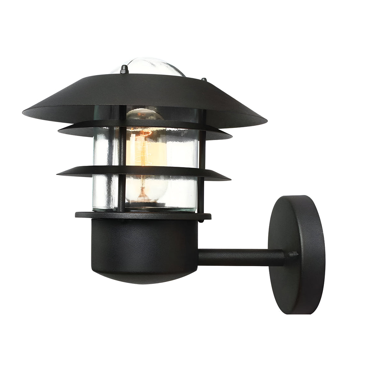 The Helsingor 1 Light Outdoor Wall Light in black embodies a Danish-inspired design with its modern look, featuring a visible bulb inside a clear glass enclosure. It includes layered metal shades and has a cylindrical base that connects to a circular wall mount, with an IP44 rating ensuring reliable outdoor use.