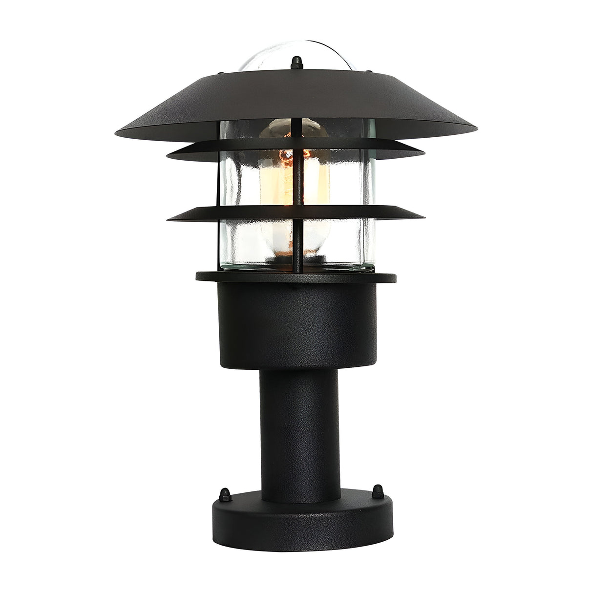 The Helsingor 1 Light Pedestal Light - Black features a Scandinavian design characterized by its sleek black metal frame and clear glass enclosure, highlighting the visible bulb within. This striking piece of outdoor lighting is enhanced by layered metal shades and a sturdy cylindrical base for lasting elegance.