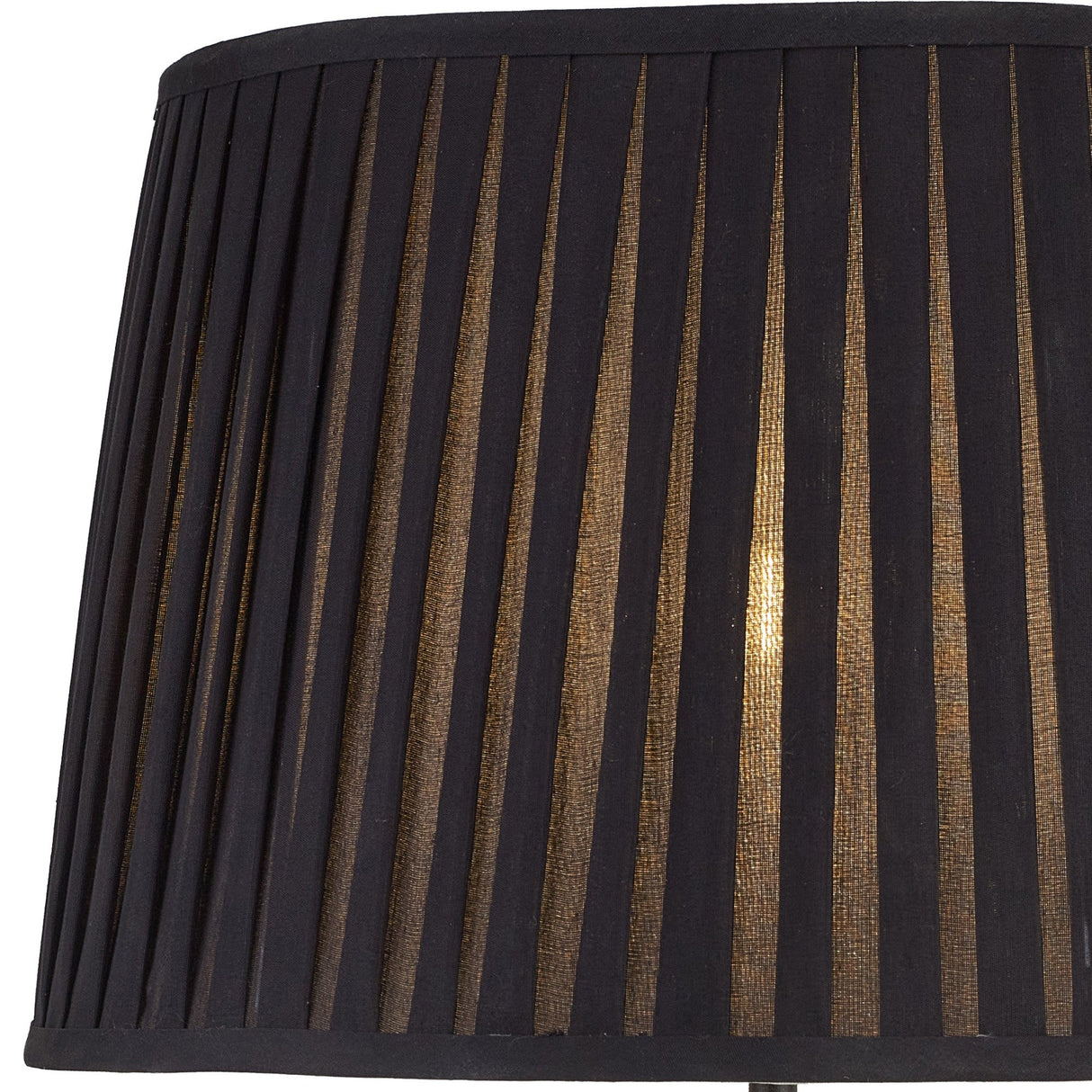 Close-up of the Hilton 1 Light Small Wood Table Lamp in black with a black shade; warm light filters through the pleated fabric, casting a modern striped pattern.