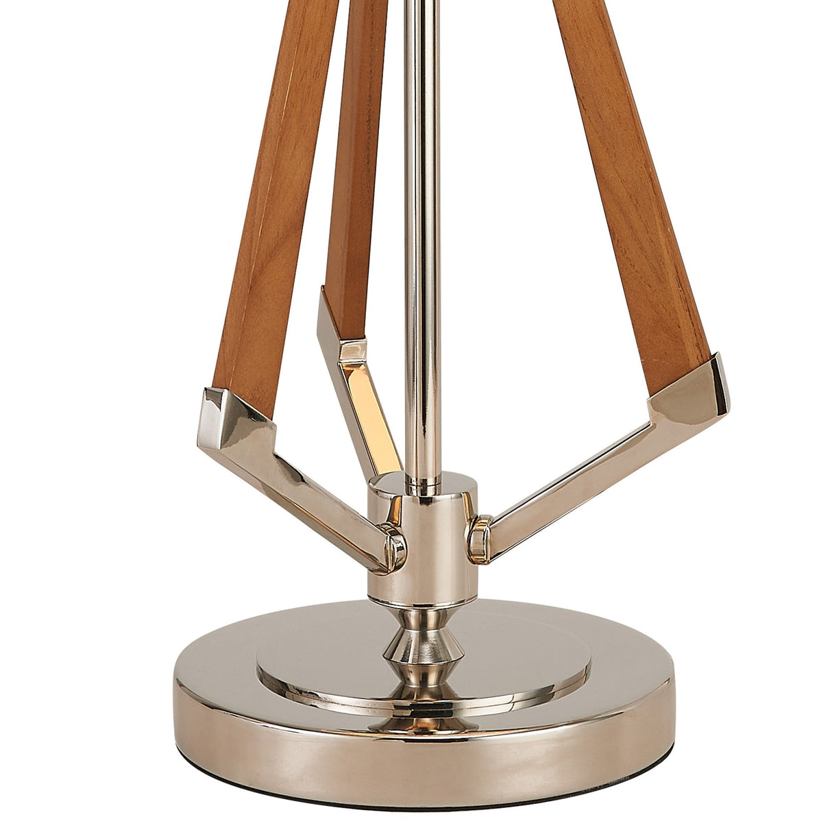 The Hilton 1 Light Wood Table Lamp features a nickel base with a shiny circular platform and three angled wooden supports connected to a central metal rod, paired with a nude beige shade.