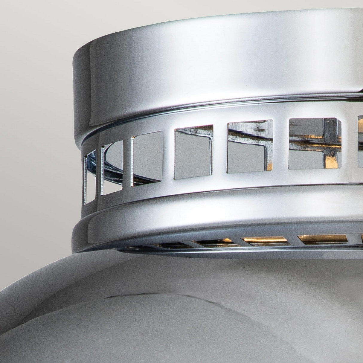 Take a look at the Amelia 2 Light Flush Light in polished chrome, featuring a contemporary design. Its sleek aesthetic is enhanced by the grid-like pattern near the base, reminiscent of a sophisticated light fixture. The subtly curved elements contribute to its refined allure.