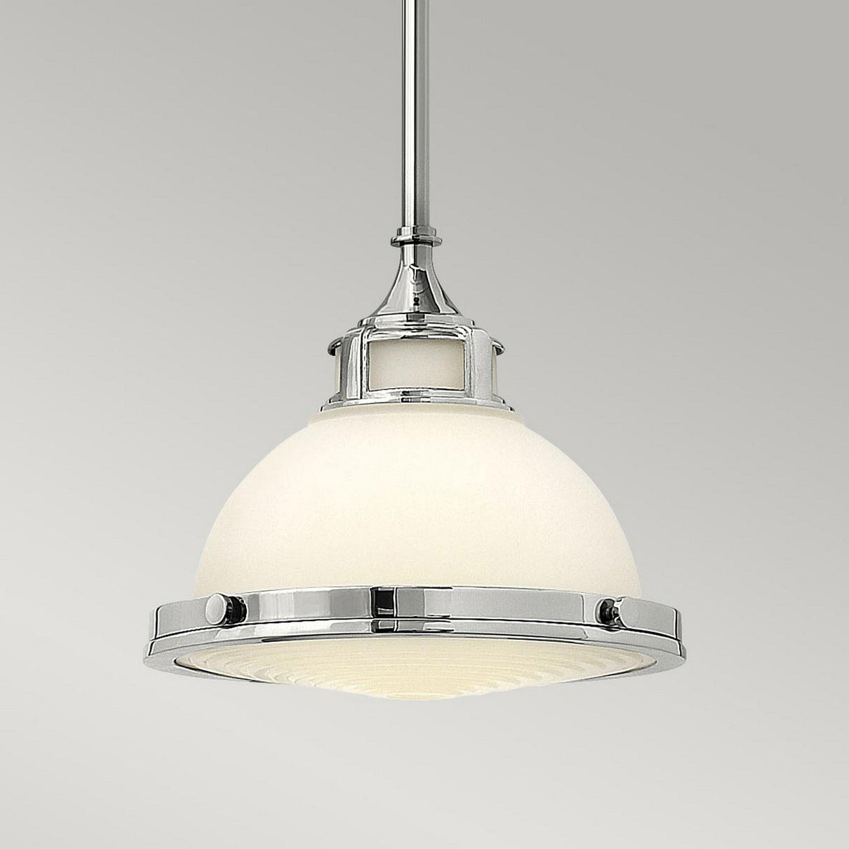 The Amelia 1 Light Mini Pendant - Chrome is a sleek, modern lighting fixture featuring an opal glass dome. Its design effortlessly combines industrial and contemporary styles, making it a perfect addition to any space.